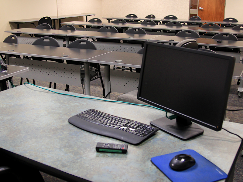 classroom with computers and chairs