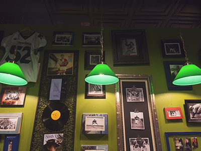 green lights in front of framed memorabilia
