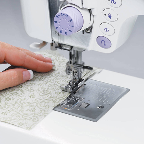 sewing machine sewing fabric