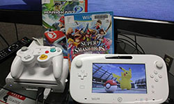 Photo of Wii U console and games.